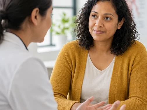 Maya speaking with her doctor during a compassionate consultation